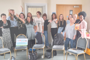A large group of diverse women at a wellbeing session